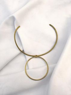 Circulo Ring - Contemporary Brass- Mahnal Jewelry Modern Metal Circle Ring Jewelry, Minimalist Metal Circle Jewelry, Minimalist Metal Circular Jewelry, Minimalist Circle Metal Jewelry, Modern Circle Necklace With Adjustable Fit, Modern Circle Shaped Brass Jewelry, Minimalist Circle Brass Necklace, Minimalist Round Metal Choker, Jewelry Journal