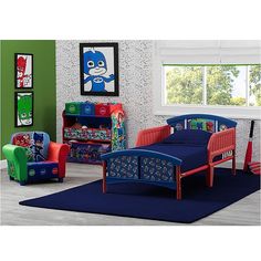 a child's bedroom decorated in blue, red and green with cartoon characters on the walls