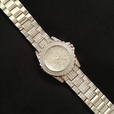 Stunning! Bold Rhinestone Encrusted Silver Watch! What A Statement Piece! Fits Up To A 8” Wrist, Has Removable Links For Size Adjustment. It’s Been Tucked Away In My Jewelry Armoire And Never Been Used... Just Needs A Battery. If You Are A Bling Queen, You Need This! Smoke Free. Silver Diamond Watch With Rhinestones And Crystal, Party Diamond Watch With Rhinestones, Silver Crystal Diamond Watch For Parties, Diamond Watch With Rhinestones For Party, Silver Diamond Watch With Crystal For Parties, Silver Diamond Watch With Cubic Zirconia For Parties, Silver Cubic Zirconia Diamond Watch For Party, Silver Crystal Watch With Rhinestones, Silver Diamond Bling Watch For Parties