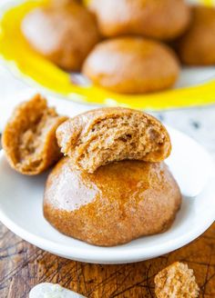 two muffins on a plate with one broken in half