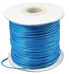 a spool of blue wire on a white background