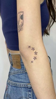 a woman with a small tattoo on her arm