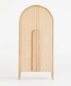 a wooden cabinet with an arched door on the top and bottom side, in front of a white background