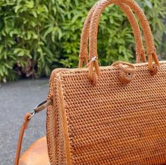 Browse our collection of rattan bags with handles for a touch of natural charm. Perfect for everyday use or a day out with friends. - Enjoy free shipping on all our rattan bags. - Dimensions: 15.5 cm x 13 cm x 12.5 cm / 6.1" x 5.1" x 5" (excluding the circle handle) - Top handle measures 15.5 cm / 6.1". - Features batik lining inside the bag, with each bag showcasing a unique pattern and color. - Each rattan bag is custom-made to order and typically shipped within seven days via DHL/FEDEX. Our s Metallic Cowhide Rug, Rattan Bags, Circle Handle, White Cowhide Rug, Patchwork Cowhide Rug, Cowhide Pillows, Mens Leather Pants, Leather Waist Bag, Cowhide Bag