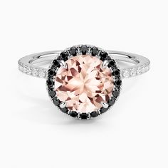 an oval pink diamond surrounded by black and white diamonds