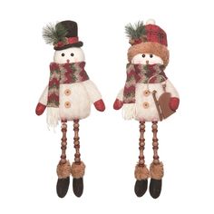 two snowmen with hats and scarfs are standing next to each other