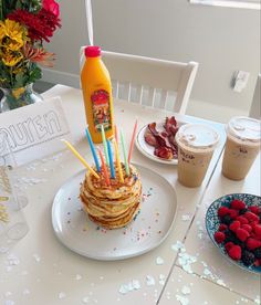 a stack of pancakes sitting on top of a white plate