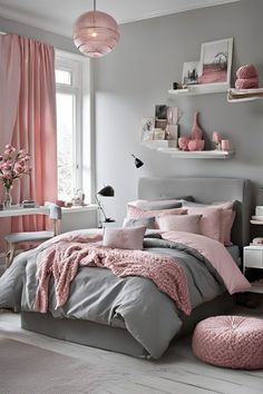 a bedroom with pink and grey decor