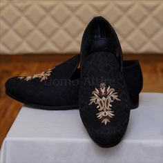 Self textured black shoes with hand embellishments for wedding Black Wedding Shoes Men, Elegant Round Toe Loafers For Groom, Black Wedding Loafers With Leather Sole, Black Wedding Loafers With Almond Toe, Black Almond Toe Loafers For Wedding, Black Slip-on Loafers For Wedding, Luxury Round Toe Loafers For Wedding, Black Embroidered Slip-on Loafers, Black Wedding Shoes With Almond Toe