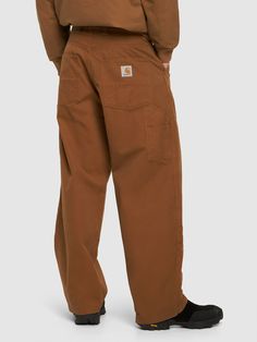 Front button and concealed zip closure. Logo details. Hammer loop. Two front pockets. Two side pockets. Two back pockets. Model is wearing a sizeM Brown Bottoms With Side Pockets For Fall, Streetwear Bottoms With Welt Pockets And Straight Hem, Fall Streetwear Cargo Pants With Welt Pockets, Classic Cargo Pants With Welt Pockets For Streetwear, Fall Cargo Pants With Welt Pockets For Streetwear, Brown Leather Pants With Pockets, Brown Straight Leg Pants With Side Pockets, Relaxed Fit Work Pants With Side Pockets For Fall, Brown Straight Leg Pants With Pockets