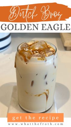 a close up of a drink in a glass with ice and caramel on top