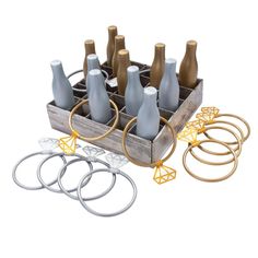 an assortment of wine bottles in a wooden crate with metal rings and springs to hold them