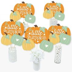 little pumpkin baby shower decorations in a vase