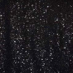 black and white photograph of the night sky with snow flakes on it's surface