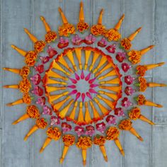 an overhead view of flowers arranged in the shape of a sun