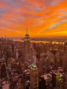 an aerial view of new york city at sunset