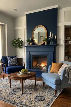 accent chairs, living room furniture, home decor, interior design, cozy seating, furniture placement, fireplace design Lounge Room Ideas Fireplace, Navy Blue Paint Living Room, Living Room With Blue Accent Wall, Blue House Interior Design, Blue Chair Living Room, Dark Blue Accent Wall Living Room, Dark Blue Fireplace, Navy Blue Fireplace, Chairs By Fireplace