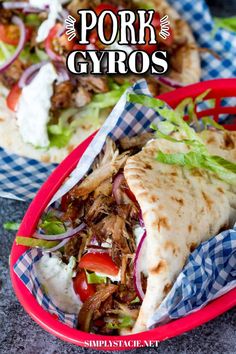 pork gyros with lettuce, tomatoes and onions in a red basket