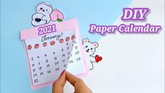 someone is holding up a calendar with the numbers on it and teddy bear stickers