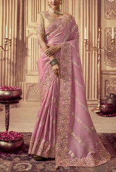 This saree is made of high-quality silk and features intricate embroidery, making it a unique and elegant garment. The deep hue is sure to make a statement and is perfect for special occasions. Crafted with skill and care, this saree is sure to turn heads. Stitching Option - We will email you the measurement guide to confirm your size. FABRIC: Fancy Silk SAREE FABRIC SIZE: 5.5 Meters BLOUSE FABRIC SIZE: 0.80 Meters SHIPPING: The product will be shipped within 1 - 2 weeks from the date of purchas Embroidery Blouse Saree, Orang India, Sabyasachi Lehenga, Ritu Kumar, Anita Dongre, Embroidery Designs Fashion, Stylish Sarees, Saree Look, Chiffon Saree