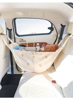 the back seat of a car with a hammock in it