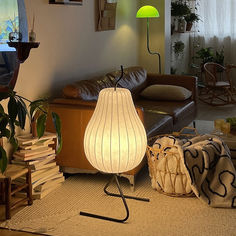 a living room filled with furniture and a lamp