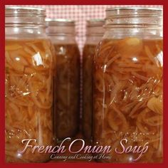 two jars filled with food sitting on top of a table