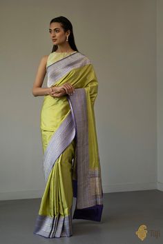 "An\u00a0everlasting saree\u00a0with\u00a0artistic patterns and a striking contrast of\u00a0colours. The border features delicate vines, laced with leaves crafted in gold and silver zari. Woven in the finest Kadiyal style, this is\u00a0the hallmark of\u00a0Banarasi textile art.\n\u00a0\n\n\nColor\u00a0-\u00a0A\u00a0stunning shade of Pear Green with a contrast\u00a0Purple border and aanchal.\n\nTechnique\u00a0-\u00a0True to form\u00a0Kadiyal technique which\u00a0helps achieve a border in a sharpl Luxury Green Katan Silk Dupatta, Luxury Silk Saree With Tilla Detailing, Luxury Tilla Traditional Saree, Luxury Green Banarasi Silk Dupatta, Luxury Katan Silk Pre-draped Saree With Dupatta, Luxury Green Handloom Dupatta, Luxury Katan Silk Saree With Sheer Dupatta, Luxury Katan Silk Unstitched Saree Suit, Luxury Multicolor Katan Silk Traditional Wear