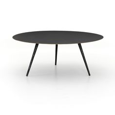 an oval table with black top and wooden legs