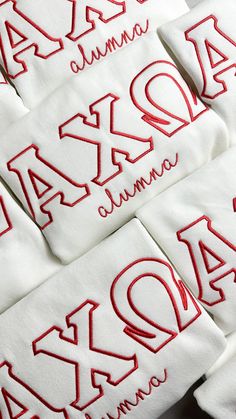 red and white embroidered numbers are arranged on top of each other