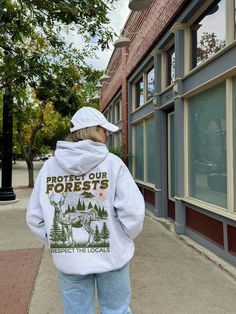 ✺  PROTECT OUR FORESTS - GRANOLA GIRL HOODIE ✺  * Q U I C K F A C T S * This design is a unique illustration that has been created in house. ✺ 50% Cotton 50% Polyester ✺ Medium-heavy fabric (8.0 oz/yd² (271.25 g/m ✺ Sizing is unisex so runs like men's, though not overly large ✺ Most women find their typical size works best, since they are meant to fit a touch loose Please note that COLOURS MAY APPEAR DIFFERENT on different digital screens and may not be a true representation of the actual colour Urban Hoodie For Outdoor Activities In Fall, Urban Hoodie With Letter Print For Outdoors, Hooded Hoodie For Fall Urban Adventures, Hooded Hoodie For Urban Adventures In Fall, Fall Sweatshirt With Adjustable Hood For Urban Adventures, Urban Hoodie With Letter Print For Outdoor Activities, Urban Hoodie With Graphic Print For Outdoor, Hooded Sweatshirt With Kangaroo Pocket For Urban Adventures, Urban Graphic Print Hoodie For Outdoor Wear