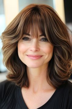 Bouncy Brown Waves with Soft Bangs Hairstyle on a smiling woman with brown hair. Volumizing Mousse, Wavy Bobs, Brunette To Blonde, Heart Face Shape