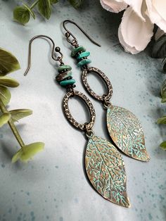 These Turquoise & Patina Leaf Earrings are so Boho Chic! With the Hammered Oval Brass Links and Brass Ear wires these are bound to make a statement! The Turquoise Chip Beads are a beautiful blue with brass spacer beads in between for a natural gemstone look   Earrings are just about 2 3/4 inches long   Ear wires are nickel & lead free  Patina Leafs are a alloy metal  I appreciate your business and do my little happy dance with every sale!  I hope you can see my real passion and attention I give Adjustable Turquoise Nature-inspired Jewelry, Turquoise Metal Jewelry With Dangling Beads, Turquoise Beaded Nature-inspired Jewelry, Nature-inspired Beaded Turquoise Jewelry, Nature-inspired Jewelry With Dangling Beads For Gifts, Nature-inspired Turquoise Beaded Jewelry, Turquoise Beaded Copper Earrings, Handmade Turquoise Beaded Metal Earrings, Turquoise Metal Jewelry With Ear Wire