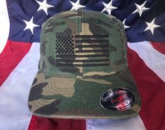 Check out our website! *** www.rhainydayhats.com ***Follow us on FB for deals and new designs! *** www.facebook.com/rhainydayhatsAmerican Flag camo embroidered hatDesign is embroidered directly on cap. This is not a patch!Hat options:*Flexfit  6977 (S/M or L/XL) fitted hat- low profileFree personalization! If you want a name on the back- please let me know the name! (And/or #) Personalization will be made in BLACK unless otherwise noted Feel free to message me with any questions! American Flag Hat, Embroidered Bucket Hat, How To Wash Hats, Camo Hat, Vintage Bucket, Papa Gifts, Patch Hat, Camo Hats, Embroidered Hat