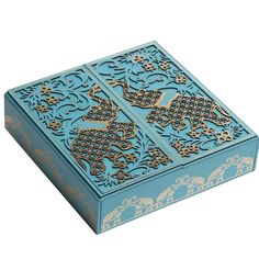 an intricately designed blue box with elephants on it