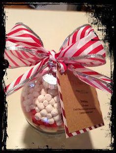 a glass jar filled with candy and marshmallows