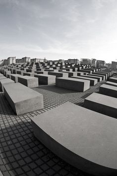 the concrete benches are lined up in rows