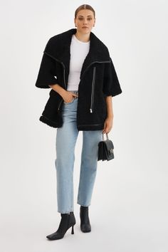 Make a statement with the Ohanna Faux Fur Coat. With its asymmetrical front zip closure and 3/4 sleeves, this coat adds a touch of elegance to any casual outfit. Versatile to style, it can be layered over a leather jacket, or worn with long leather gloves. Winter Outerwear With Asymmetrical Side Zipper, Spring Outerwear With Asymmetrical Zip And Zip Cuffs, Modern Outerwear With Asymmetrical Zip For Fall, Modern Asymmetrical Zip Outerwear For Fall, Modern Fall Outerwear With Asymmetrical Zip, Modern Outerwear With Zipper For Fall, Trendy Asymmetrical Zip Outerwear With Zipper Closure, Trendy Outerwear With Asymmetrical Zipper Closure, Spring Workwear Outerwear With Side Zipper