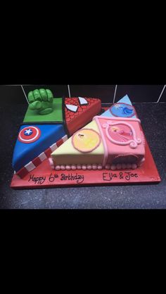 a birthday cake made to look like the avengerss