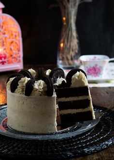 there is a cake that has been cut in half on the plate and ready to be eaten