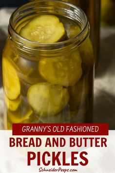 a jar filled with sliced up pickles on top of a table