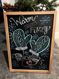 a chalkboard sign that says nom fuzzy holiday wishes