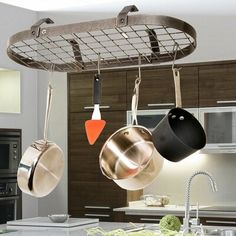 pots and pans hanging from the ceiling in a kitchen