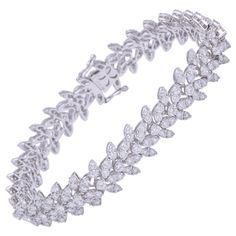 Beautiful diamond bracelet. 9.17 carats of round brilliant cut diamonds set in a wreath design. 18k white gold Approximately 10.70 mm wide, 7 inch length. An elegant diamond bracelet designed to compliment pieces in your existing collection. Expensive Bracelets, Diamond Bracelet Design, Platinum Bracelet, Expensive Jewelry Luxury, Gold Link Bracelet, Antique Bracelets, Diamond Jewelry Designs, Luxury Diamonds, Expensive Jewelry