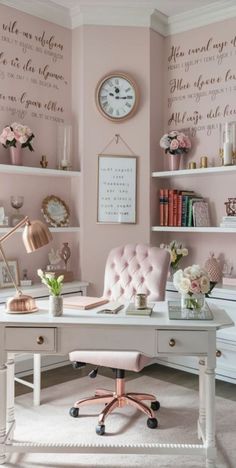 a white desk topped with a pink chair next to a shelf filled with books and flowers