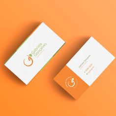 two business cards on an orange background