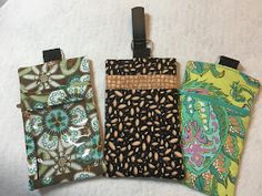 four cell phone cases sitting on top of each other