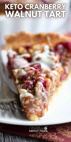 a piece of keto cranberry walnut tart on a white plate