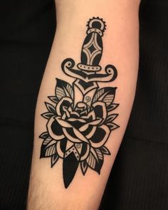 a black and white tattoo design on the arm