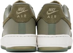 Nike.Green Air Force 1 '07 LV8 Sneakers.Low-top grained leather sneakers in green..· Perforated detailing at toe and sides.· Lace-up closure.· Logo patch at tongue.· Padded collar.· Suede Swoosh appliqué at sides.· Logo embroidered at heel tab.· Mesh lining.· Treaded rubber sole.Please note that this item may be shipped only within North America..Supplier color: Dark stucco/Medium olive.Upper: leather. Sole: rubber..Made in Viet Nam..241011M237113 Green Leather Nike Air Force 1 Sporty Shoes, Casual Green Sneakers With Embossed Logo, High-top Nike Air Force 1 With Embossed Logo, Green Leather Nike Air Force 1 With Round Toe, Nike Air Force 1 Low-top With Embossed Logo, Nike Air Force 1 With Embossed Logo For Sports, Green Leather Nike Air Force 1 For Sports, Nike Air Force 1 Sports Leather With Embossed Logo, Nike Air Force 1 Green With Gum Sole